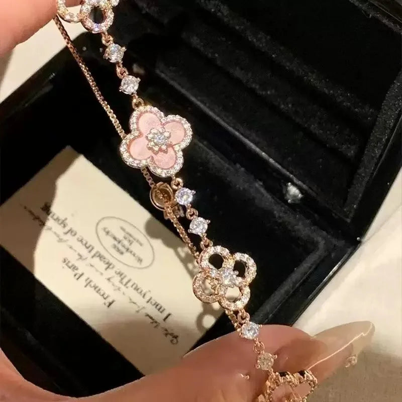 GLOSSMOON Sakura Cleef Bracelet Fashionable and Elegant Cherry Blossom Bracelet Does Not Change Color and Is Not Allergic  The Sakura Clover Bracelet showcases a multitude of brilliant diamonds, forming a luminous sparkle tha
