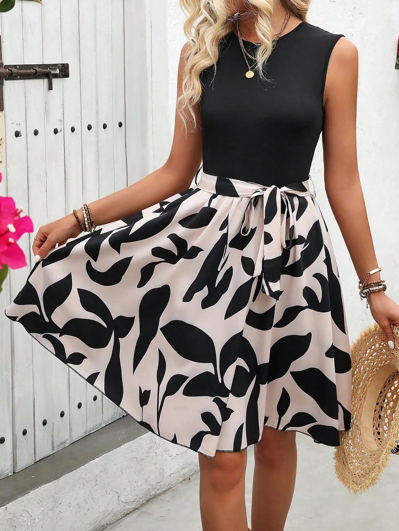 Sleeveless Black Top With High-Waisted Striped A-Line Skirt And Self-Tie Waistband For Summer Vacation